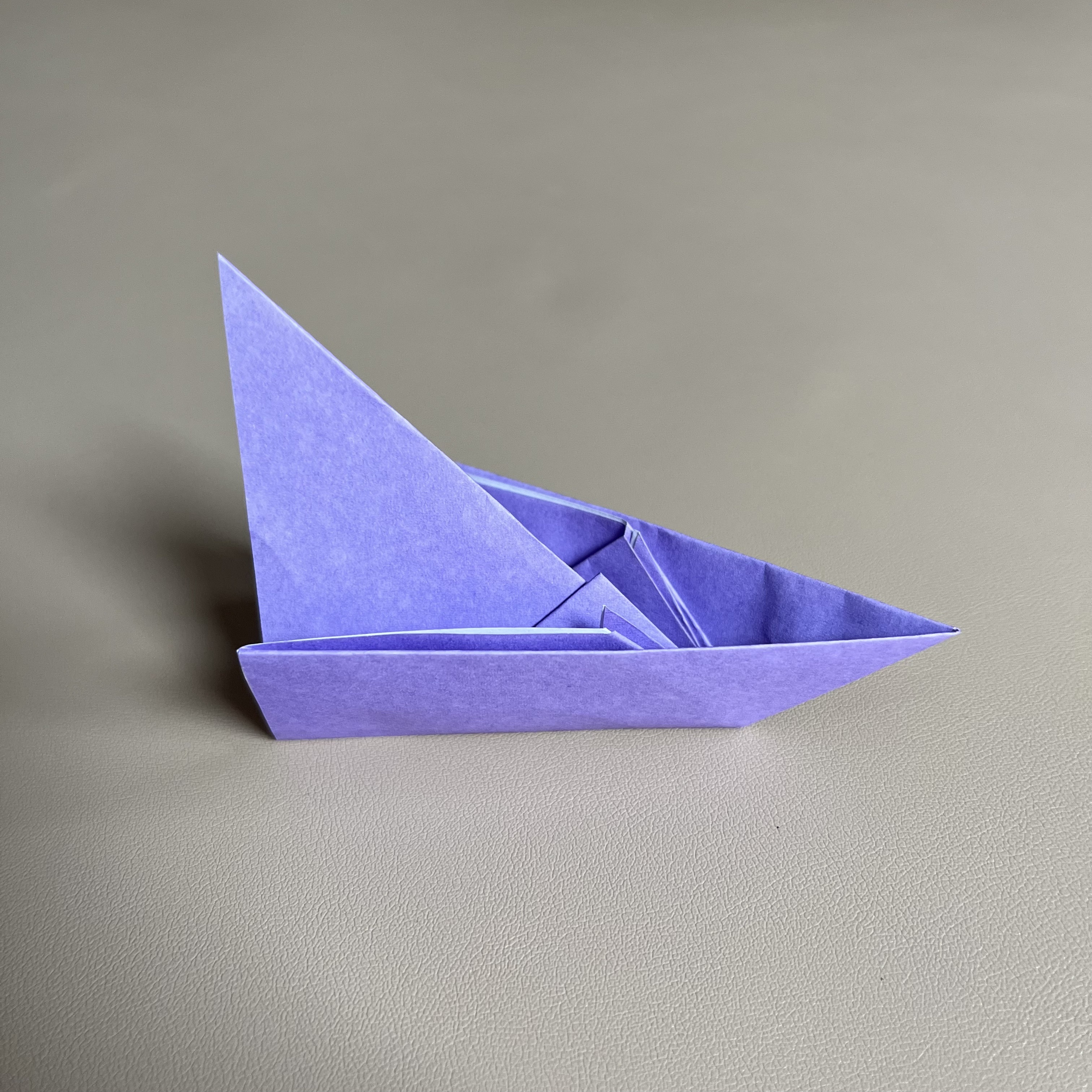 A purple origami boat
