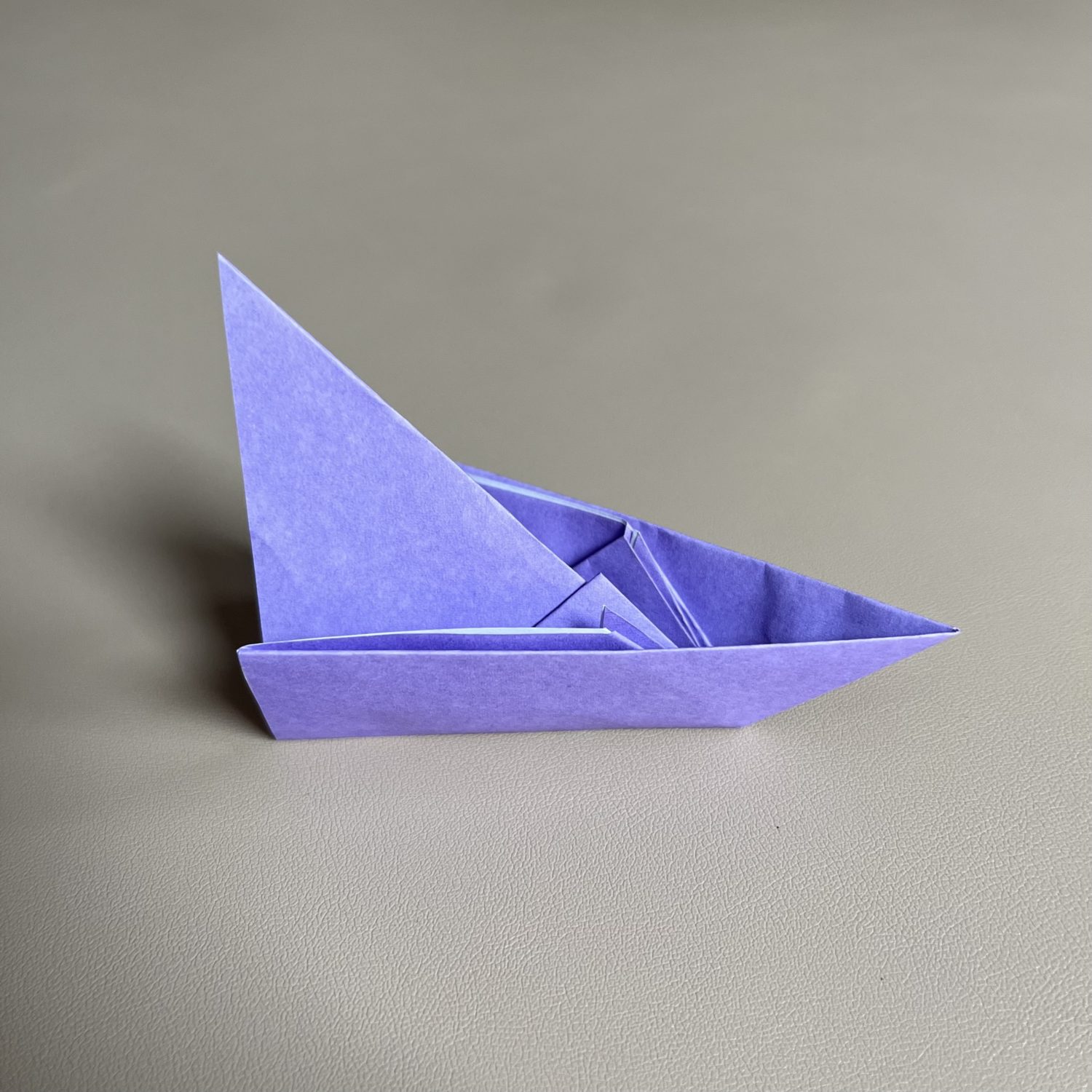 A purple origami boat