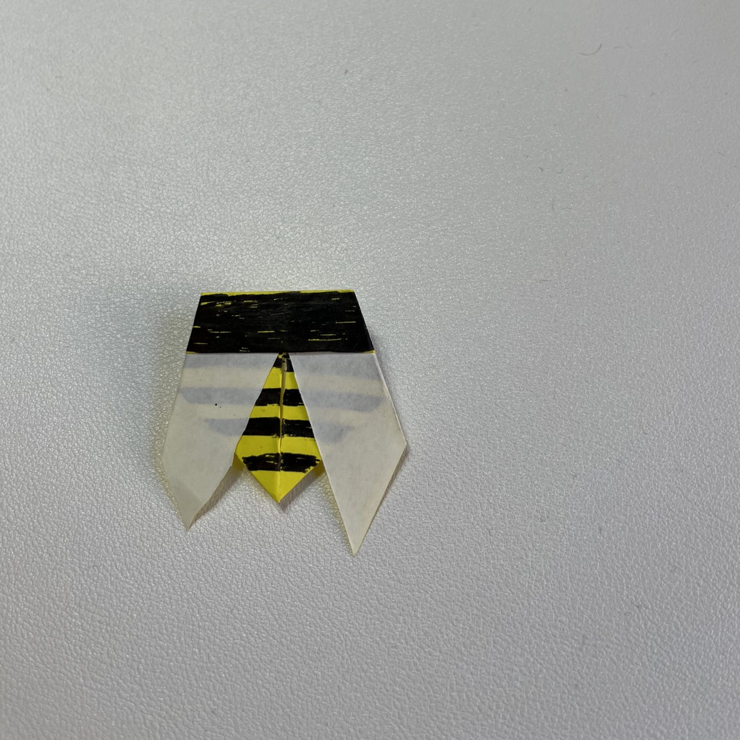 Origami bee brooch.